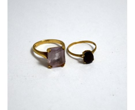 TWO RINGS, the first a 9ct gold paste ring together with a garnet ring, ring sizes M 1/2 and L 1/2