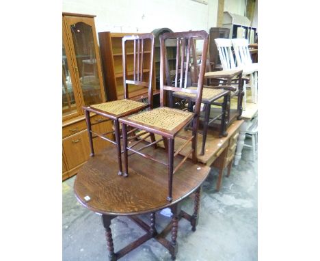 AN OAK BARLEY TWIST GATE LEG TABLE, four various cane seated chairs and two other chairs (7)