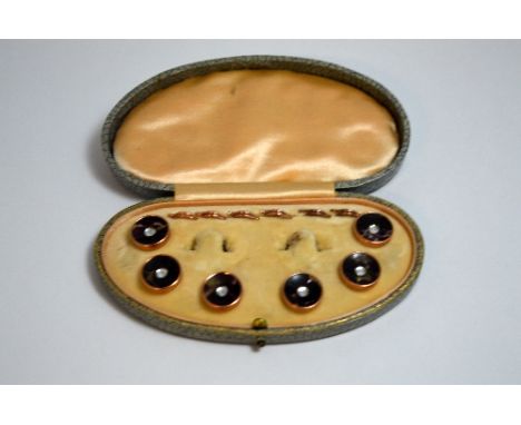 A BOXED SET OF BUTTON STUDS, within fitted box