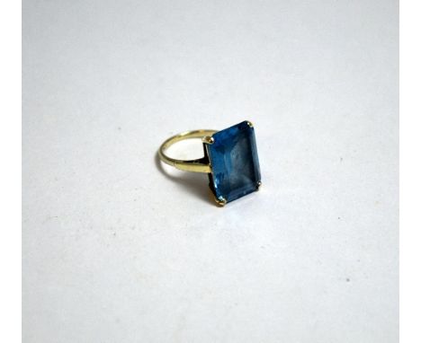 A TOPAZ DRESS RING, with large rectangular topaz to the plain tapered shank, stamped 9ct