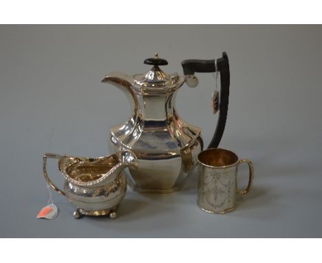 A GEORGE V SILVER HOT WATER JUG, Sheffield 1930, a George III milk jug and a christening tankard (3)