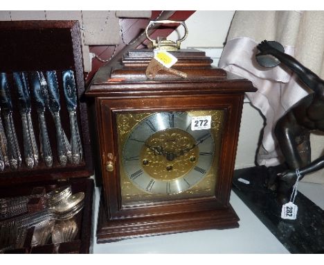 A MANTLE CLOCK, (key and pendulum)