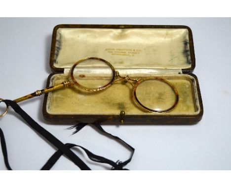 A CASED SET OF LORGNETTES, with tortoiseshell effect enamel rim to handle