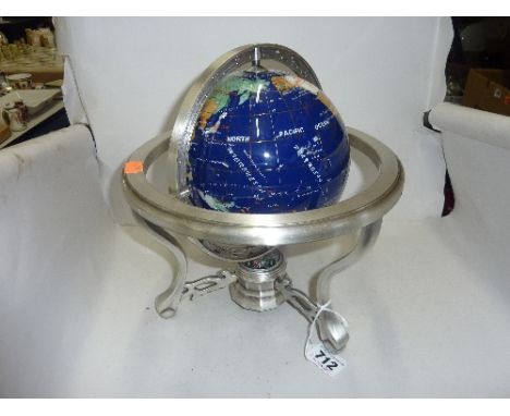 A NOVELTY TABLE TOP GLOBE/COMPASS, set in metal stand