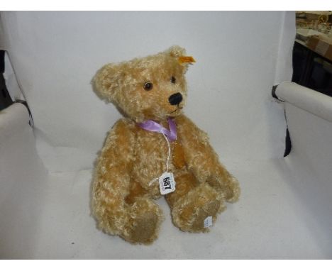 AN UNBOXED STEIFF GOLDEN PLUSH BEAR, a 2003 bear produced exclusively for Danby Mint, complete with medallion, height approxi