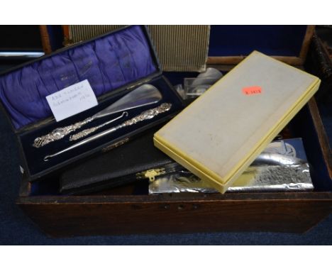A BOX OF SHOE HORNS, and button hooks