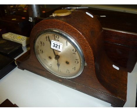A MANTLE CLOCK, (key and pendulum)