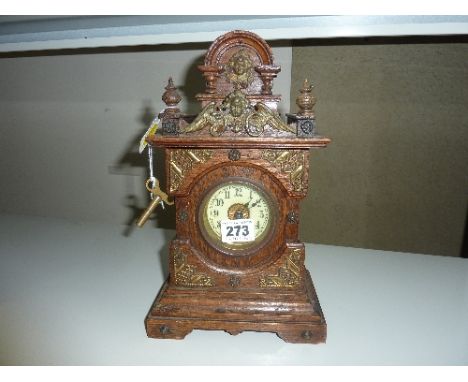 A MANTLE CLOCK, (key and pendulum)
