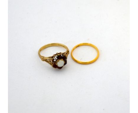 TWO RINGS, the first a 22ct gold band ring, the second a 9ct gold opal and garnet cluster ring (one stone deficient)