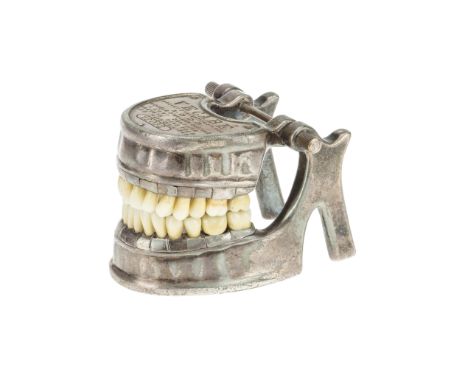 A Vecabe Dental Model, French, c. 1920, by VecabÃ©, full set of teeth made from enamel, each one secured to the mandible with
