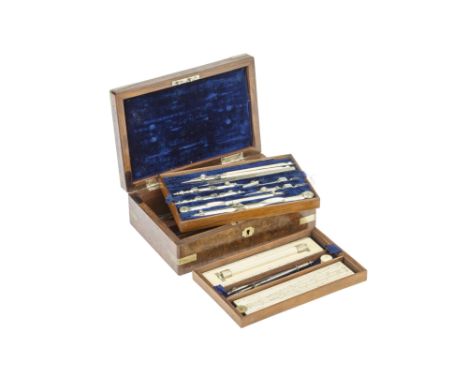 A Good Irish Set of Drawing Instruments c. 1860, nickel-silver bound burr walnut case with three trays of instruments in nick