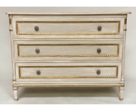 COMMODE, French Louis XVI style, grey painted and parcel gilt with three long drawers and fluted corners and supports, 115cm 