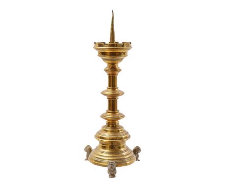 Brass pen candlestick standing on lion feet, 42 cm high