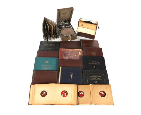 His Master's Voice suitcase record player with a large collection of Bakelite LPs in 15 albums and 1 suitcase