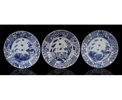 3 porcelain dishes with blue and white decoration of birds on rock and butterfly in flower garden, China Kangxi period, 23 cm