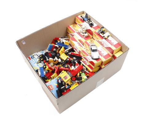 Box with Lego toys and boxes with Solido cars