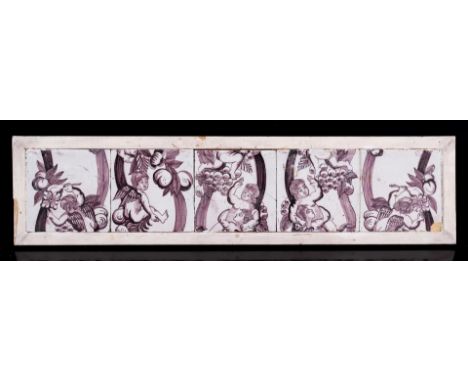 Manganese tile tableau of 5 tiles with decoration of angels in grape vines in wooden frame, Holland 17th/18th century, 17x69 