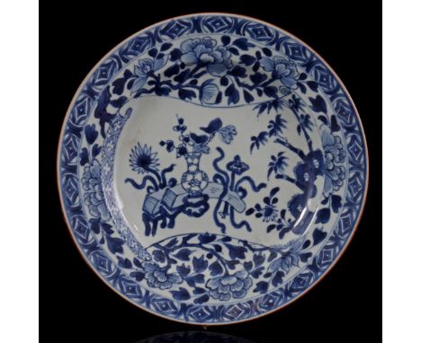 Porcelain dish with blue and white floral decor depicted on a piece of parchment, China Kangxi/Yongzheng period, 22.5 cm in d