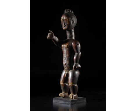 African art Ivory Coast, Attie. Puppet? with movable arms.Wood with dark patina and metal pivots. Early 20th c. . Cm 20,00 x 