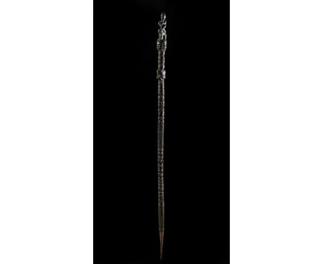 Himalayan Art A carved wooden stick Tibet, 19th century . . Cm 4,00 x 115,00 x 4,00.