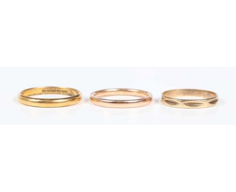 A 22ct gold wedding ring, Birmingham 1939, weight 3.4g, ring size approx Q1/2, and two further gold wedding rings, both unmar