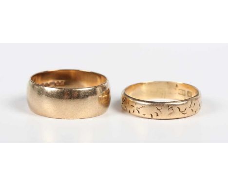 A 22ct gold decorated wedding ring, partial marks, weight 3.8g, ring size approx P, and a 9ct gold wedding band ring, weight 