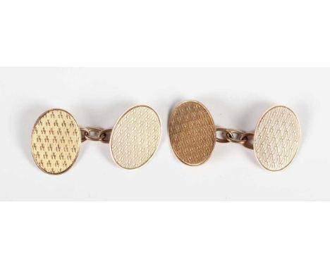 A pair of 9ct gold oval cufflinks with engine turned decoration, Birmingham 1925, weight 6.2g, dimensions of each front 1.7cm