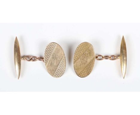 A pair of 9ct gold cufflinks, each oval front with engine turned decoration, Birmingham 1963, weight 4.4g, dimensions of each