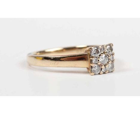 A 9ct gold and diamond square cluster ring, mounted with five principal circular cut diamonds and four smaller circular cut d