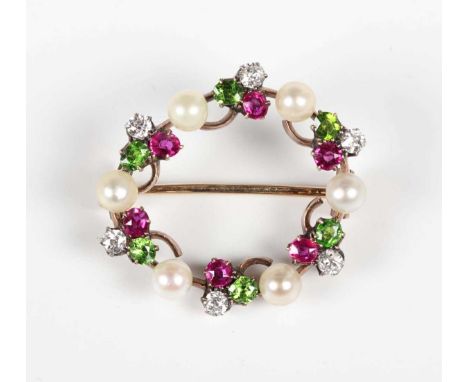 A gold backed, diamond, ruby, demantoid garnet and pearl brooch, designed as a wreath with trefoil shaped motifs at intervals