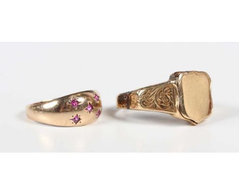 A gold shield shaped signet ring, the front with a hinged locket compartment, weight 5.2g, (part of shank lacking), and a 9ct