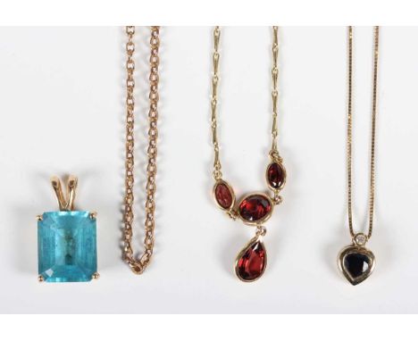 A 9ct gold and garnet pendant necklace, the front mounted with four variously cut garnets, Birmingham 1983, on a hook shaped 