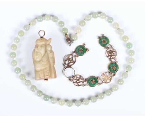 A Chinese hardstone pendant, late Qing dynasty, carved in the form of a bearded elder holding a child, height 4.9cm, a jade b