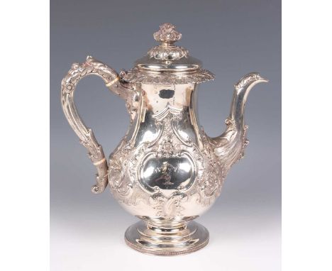 A George IV Scottish silver baluster coffee pot, the domed lid with foliate finial above a cast band of ivy leaves, the flora