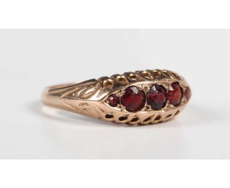 A 9ct gold and garnet five stone ring in a boat shaped design, Chester 1920, weight 1.7g, ring size approx L1/2.