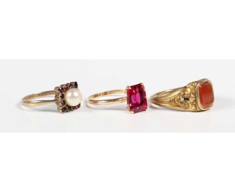 A Victorian gilt metal and cornelian signet ring, ring size approx O1/2, a gold, garnet and imitation pearl square cluster ri