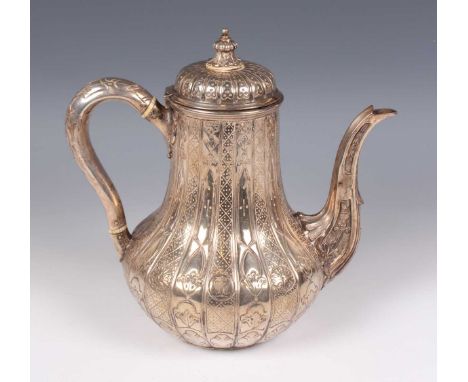 A Victorian silver hot water pot of low-bellied form with domed hinged lid, crest engraved with a twin-headed eagle beneath a