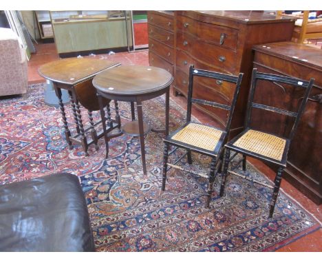 An Edwardian mahogany lamp table, to caned and ebonised chairs and an oak drop leaf table 