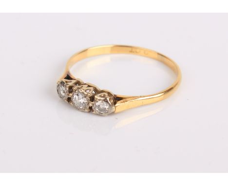 An 18ct gold and diamond three stone ring, 1.9g in total