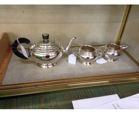 A three piece tea service each with ribbed design and sectional handles G.Bryan & Co, Birmingham, 1939 20oz 