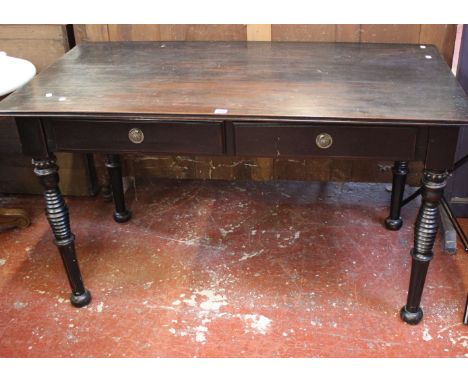 A Victorian ebonised desk with two frieze drawers pierced frieze on tight ring turned legs 135cm wide 