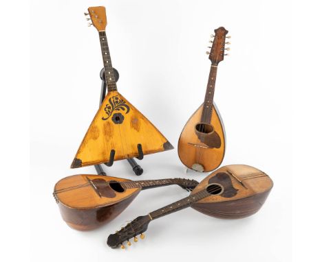 Three mandolines and a Balalaika. 20th C.&nbsp;Fratelli Umberto, La Vesuvienne,&nbsp;Marius.&nbsp;Dimensions: (D:43 x W:67 x 