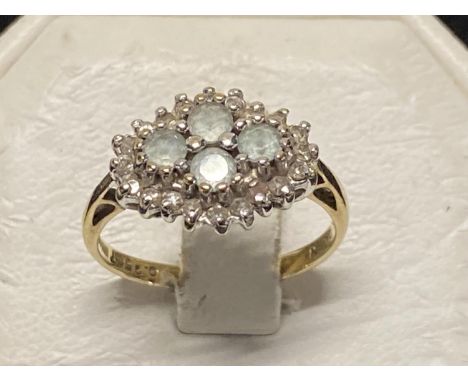 A 9 ct gold and white stone cluster ring 2.61g 