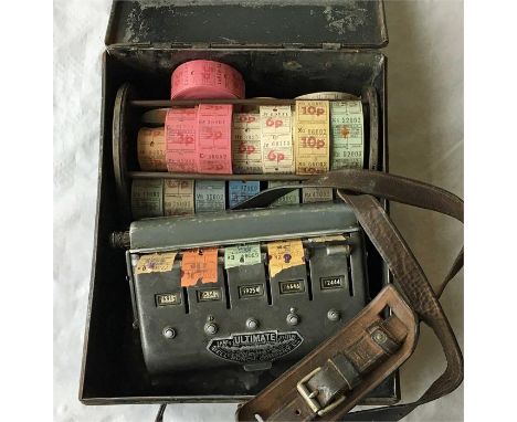 An 'Ultimate' TICKET MACHINE, issues 5 values, complete with strap, carrying box and quantity of ticket rolls. Operator unkno