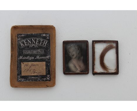 Housed in a display box, the hair clipping comes from the actress's hairdresser Kenneth Battelle and is dated June 14, 1959. 