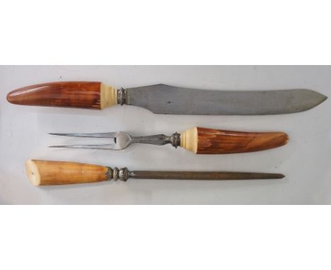 A pair of Victorian carvers with stained ivory handles, the blade of the knife marked Joseph Rogers & Sons, Cutlers to her Ma