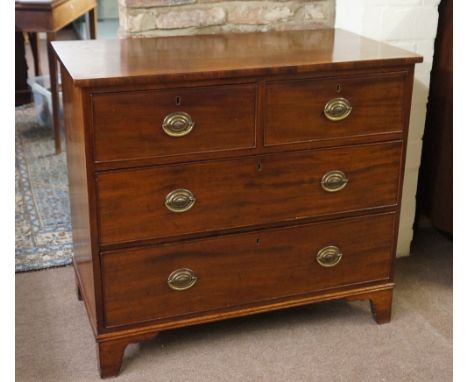 An early 19th Century mahogany chest, bracket feet, brass escutcheon and handles, 95cm wide, 85cm high 
