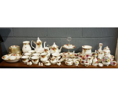 A large quantity of Royal Albert pattern china, to include: miniature tea set with teapot, cup, saucer and jug, each dated 19