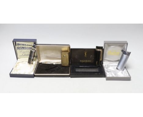 An Yves Saint Laurent lighter and three others, boxed