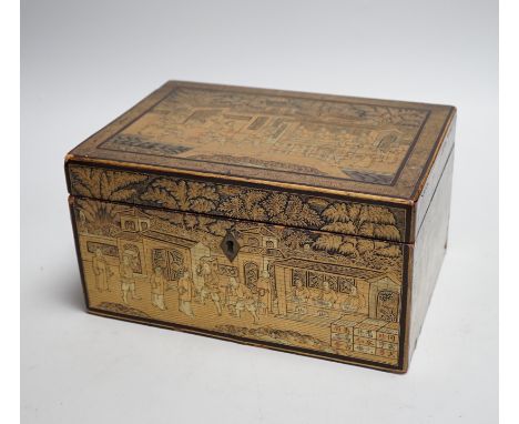 A 19th century Chinese export lacquer tea caddy, black ground with gilt decoration, containing a separate lidded pewter linin